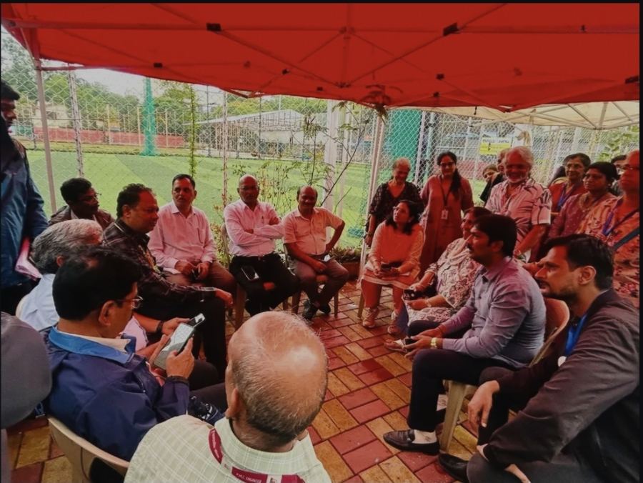 Open meeting with residents held under a shamiana
